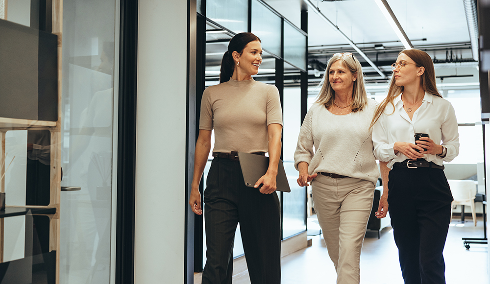 Coworkers walking in an office